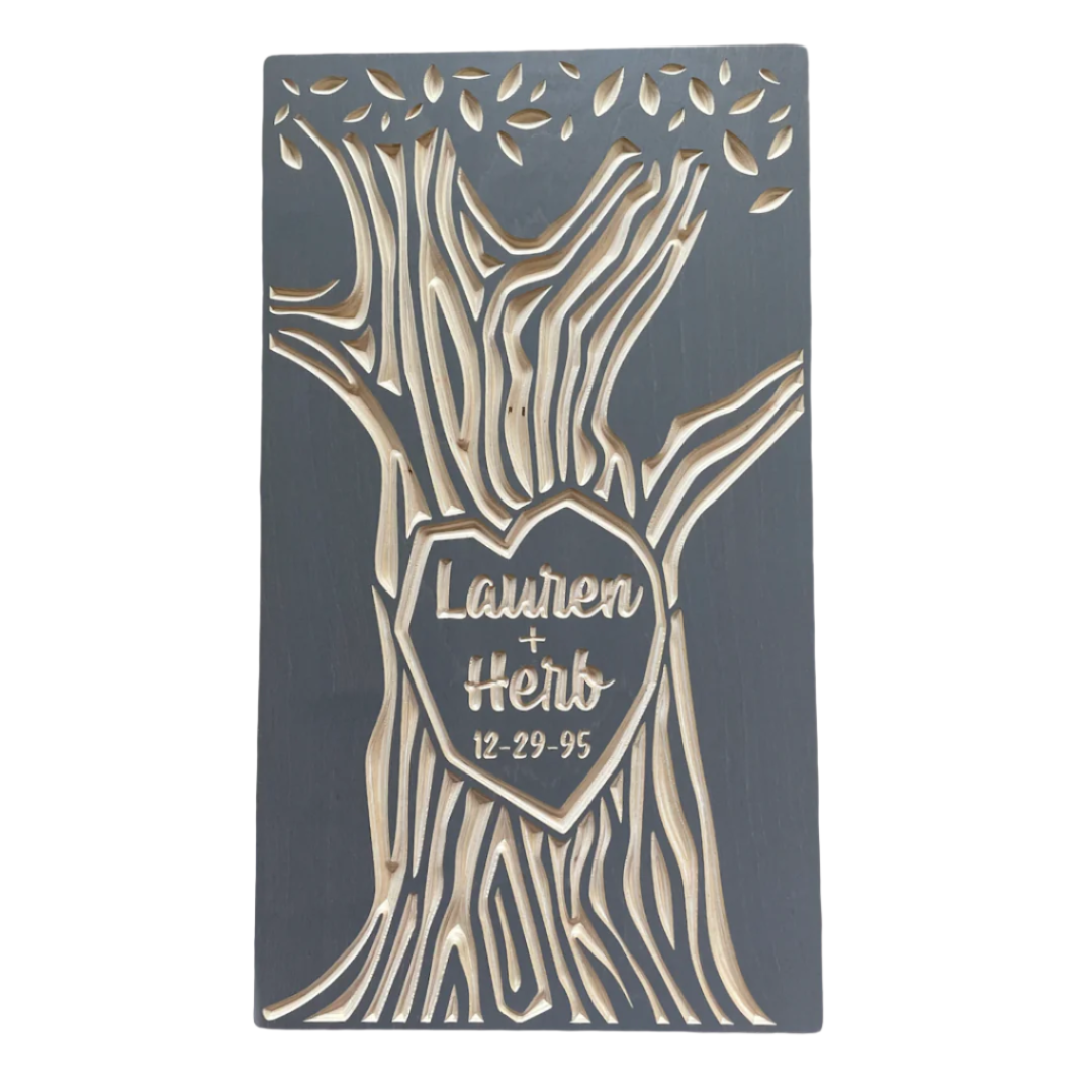 custom carved tree with couple's names. shown in gray color.