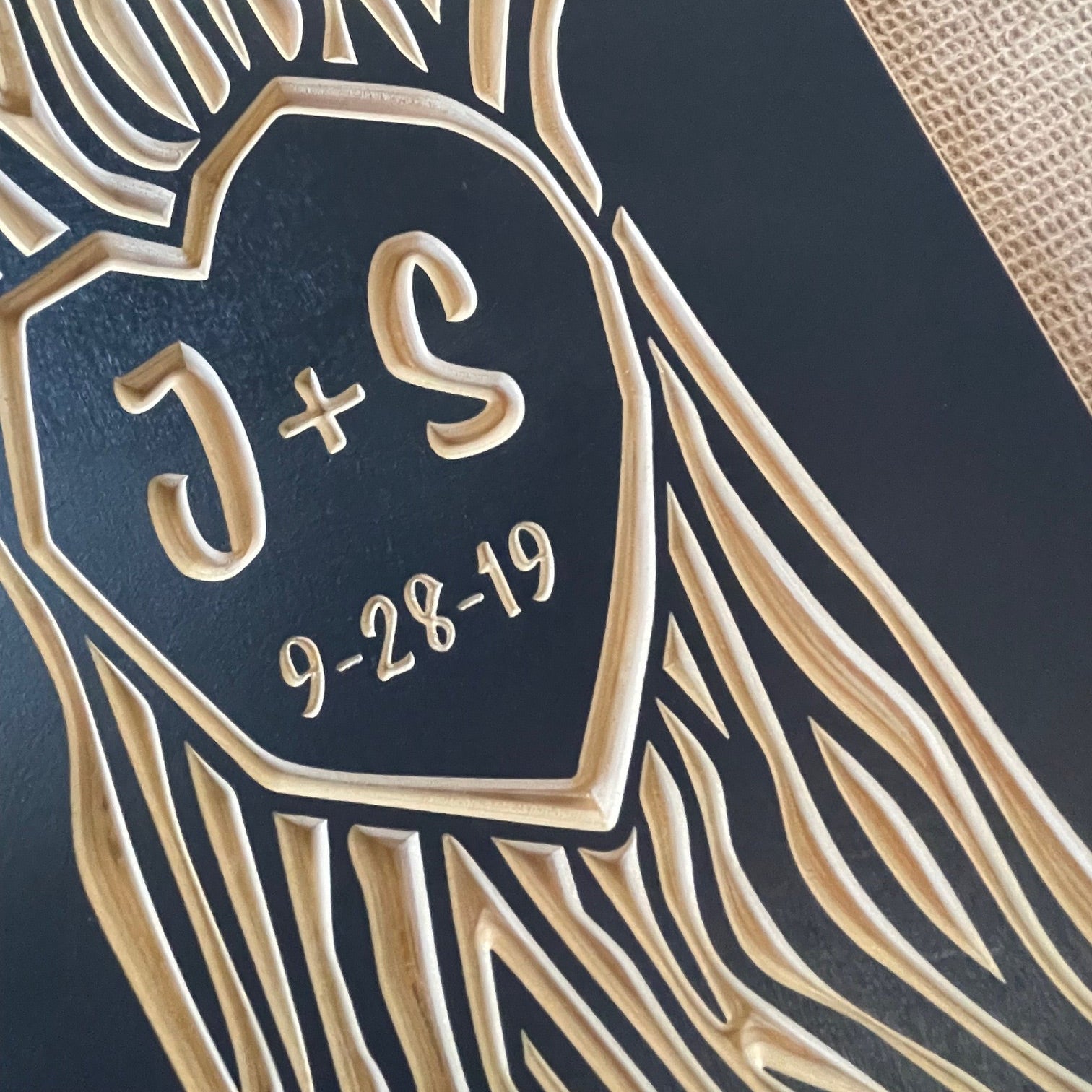 closeup of initials carved in tree. navy color option.