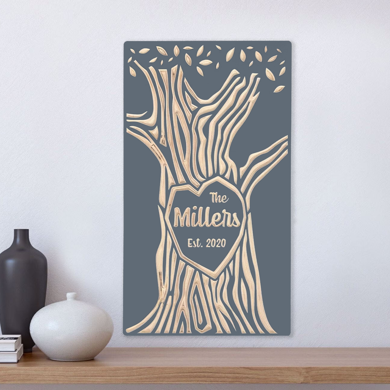 Family last name carved into wood tree, gray finish