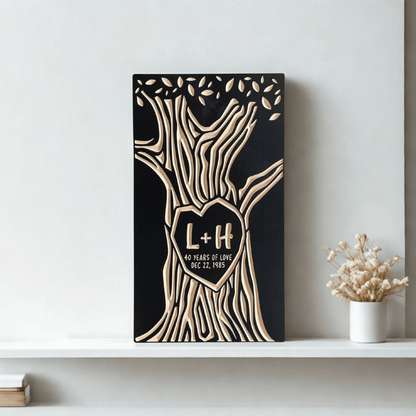 Decorative wall art with tree design and personalized with 'L+H' initials and "40 years of love" on a shelf.