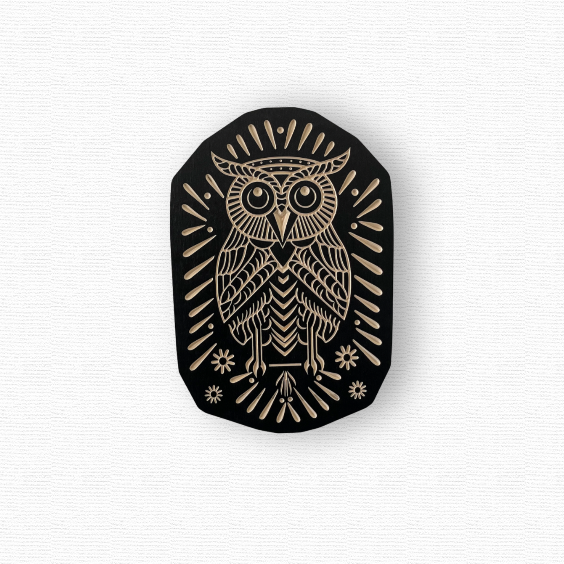 Black and birch wood owl design on a white background
