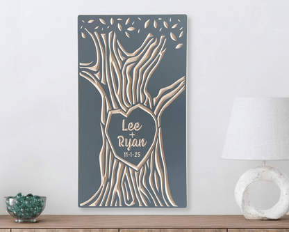 Wood wall art with tree design and personalized names on a gray background