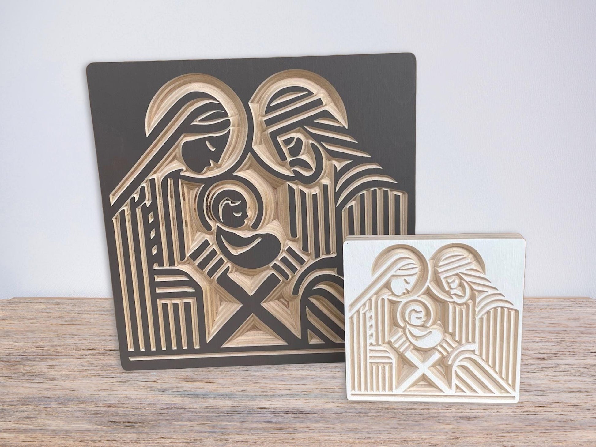 Modern wooden nativity shown in standard and small sizes.