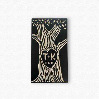 Decorative wall art with tree design, heart-shaped center, and initials 'T' and 'K' on a white background.