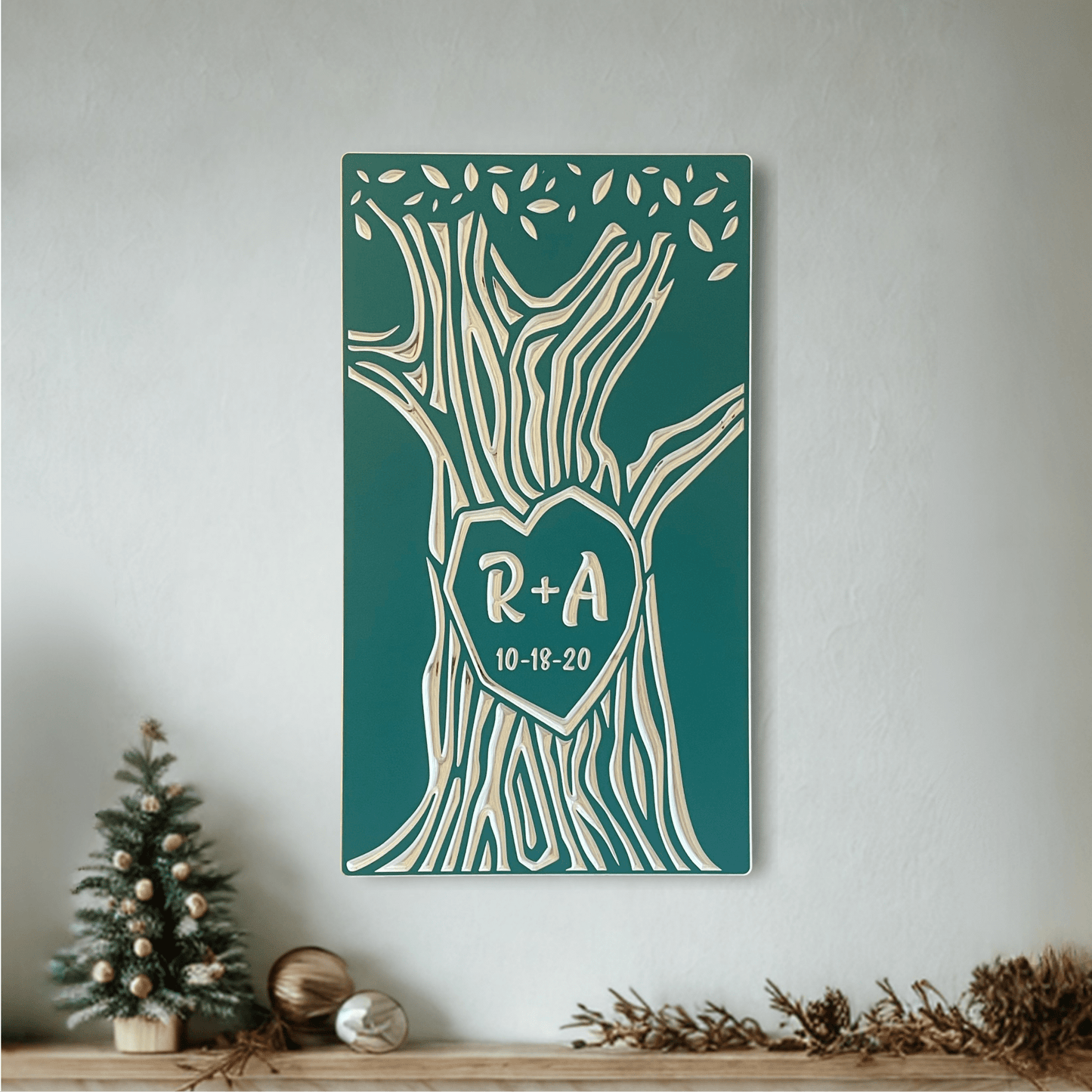 Teal Personalized Anniversary gift, custom carved tree with initials and date, hanging above a mantle with holiday decorations.