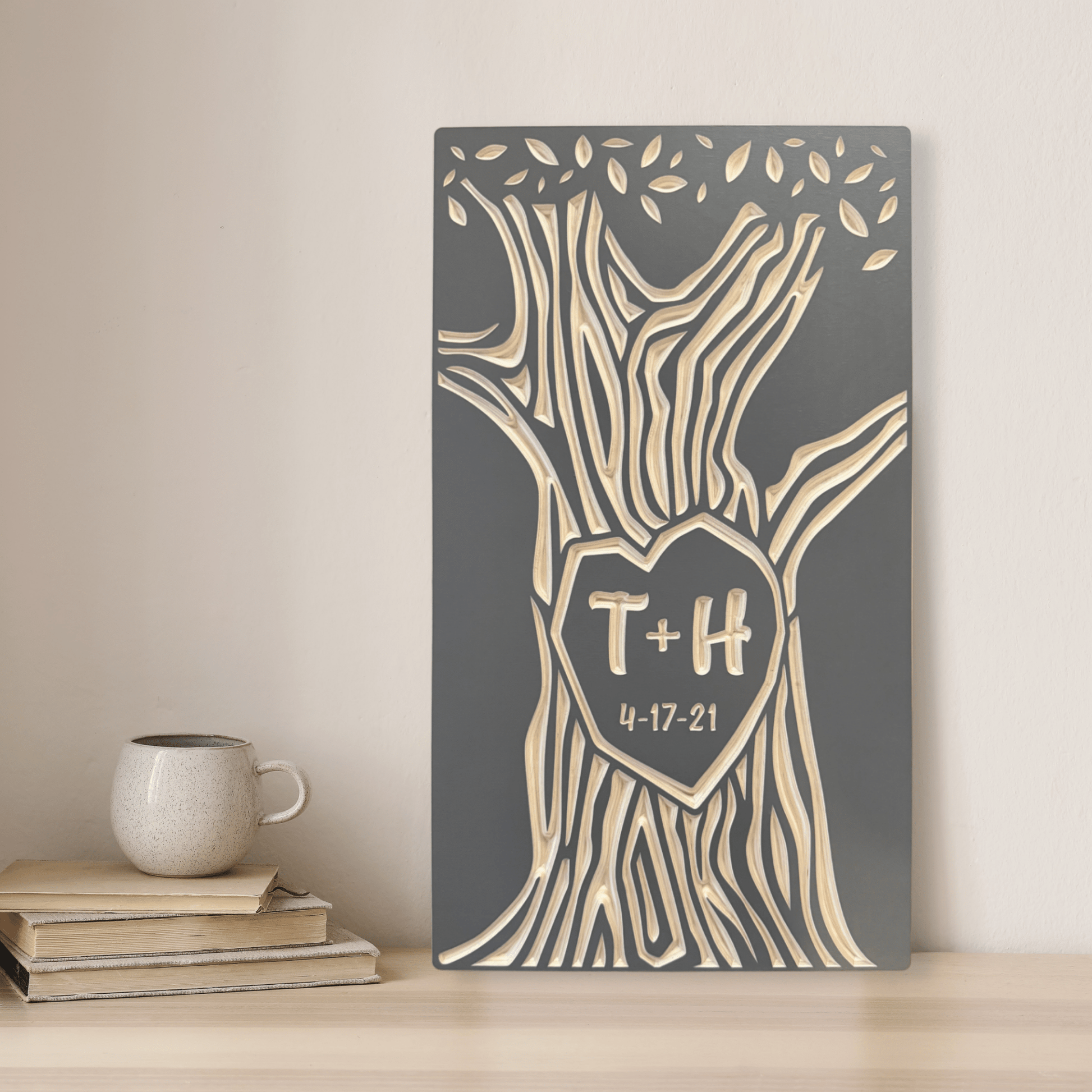 Decorative wood anniversary wall art with tree design and initials on driftwood gray stained birch background, placed on a shelf.