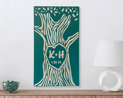 Decorative wall art with tree design and personalized text on a teal background, placed on a wooden surface.